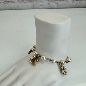 CHANEL 09A Rare Camelia CC Gold and White Pearl Bracelet